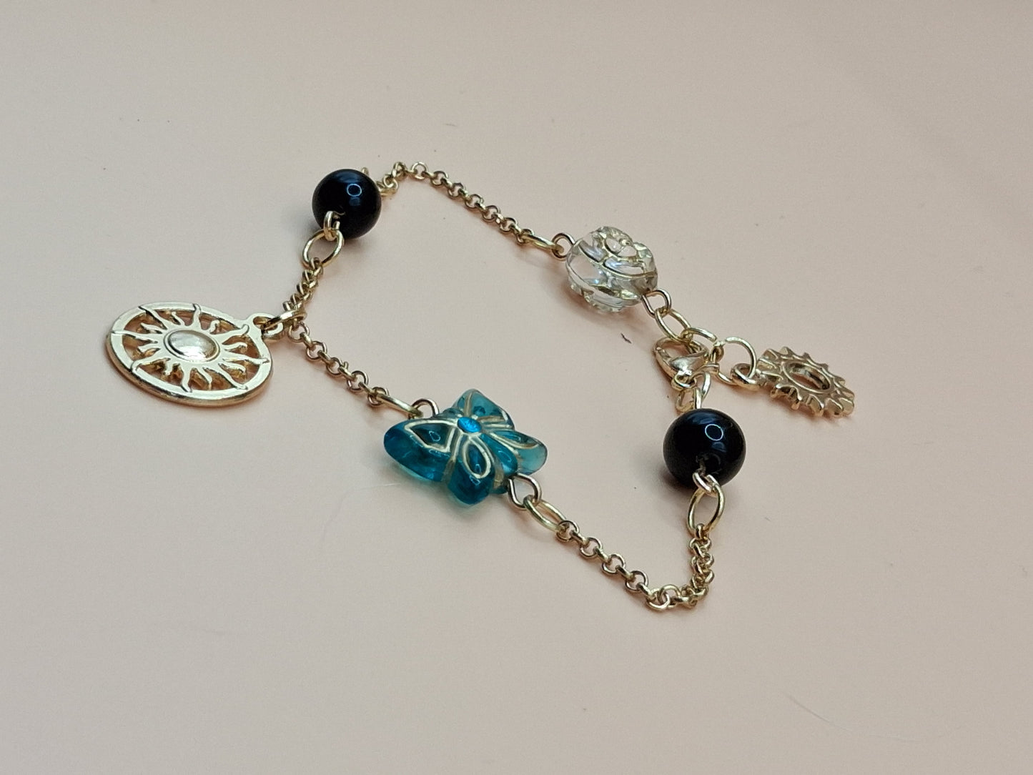 Gold-Toned Celestial Charm Bracelet with Sun Medallions & black Beads