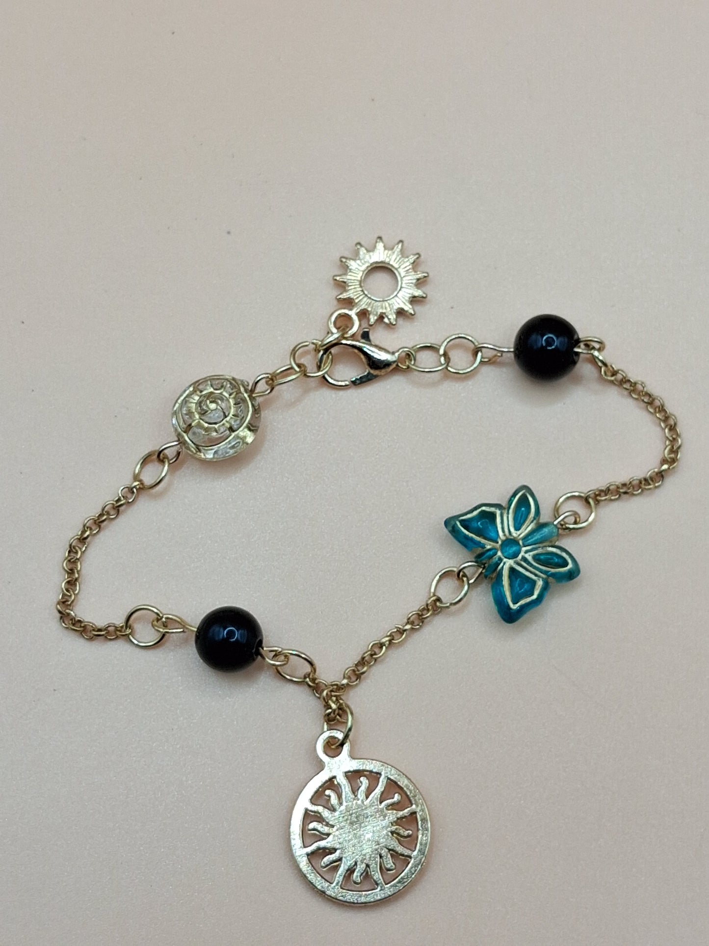 Gold-Toned Celestial Charm Bracelet with Sun Medallions & black Beads