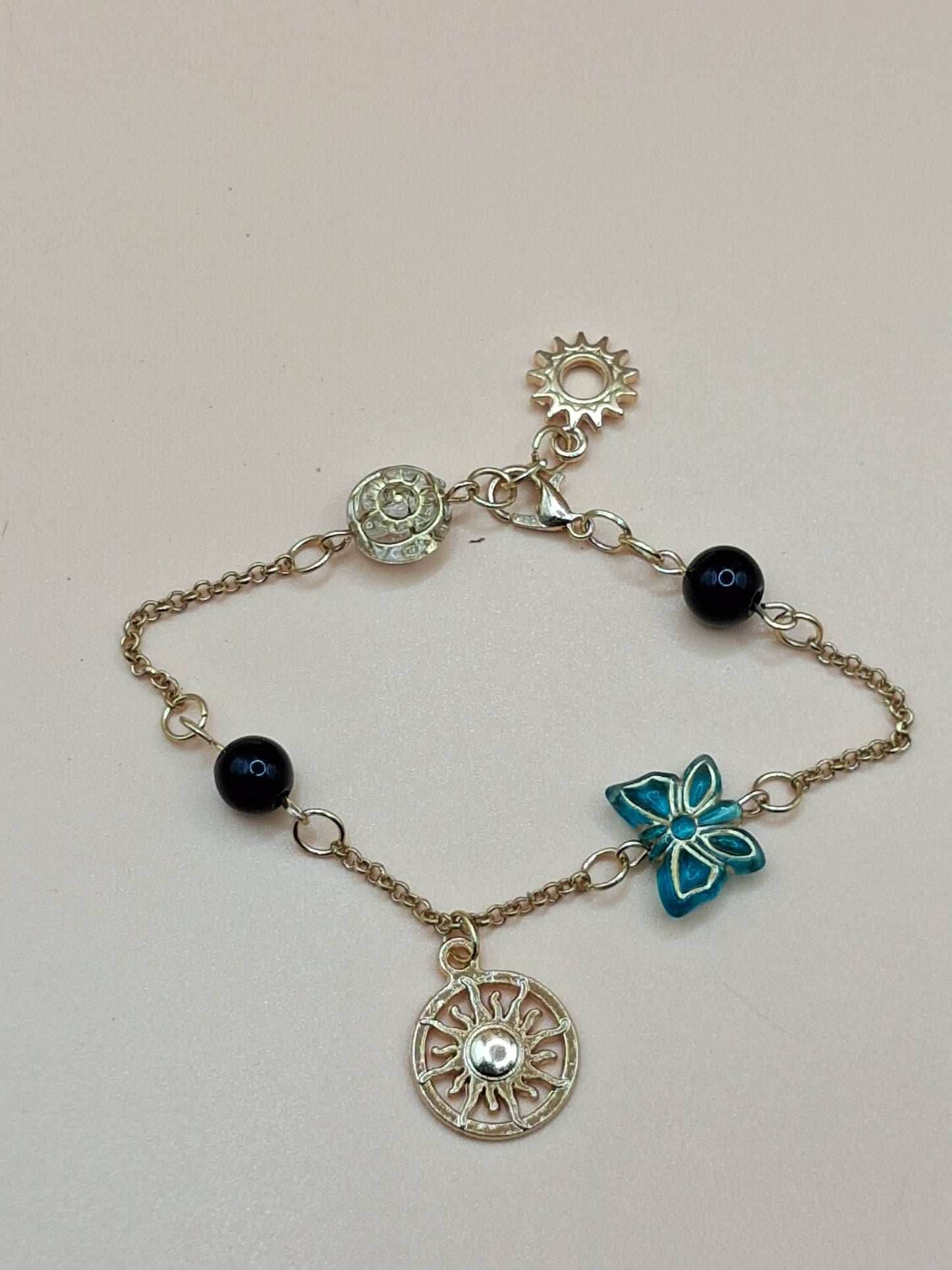Gold-Toned Celestial Charm Bracelet with Sun Medallions & black Beads